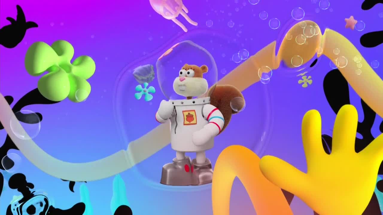 Sandy Cheeks, in her space suit, stands confidently in a swirling, dreamlike environment. Floating around her are various cartoonish shapes, bubbles, and a jellyfish.
