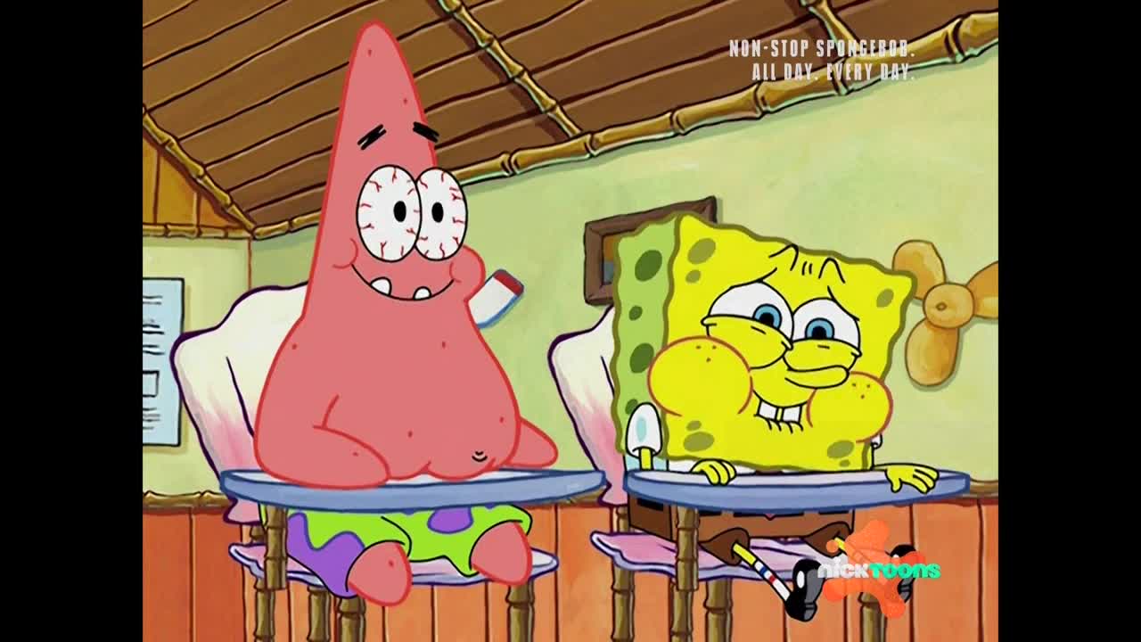 Patrick, with bloodshot eyes, holds a small white object, smiling at SpongeBob. SpongeBob, cheeks puffed out, looks down at his desk with a goofy grin.
