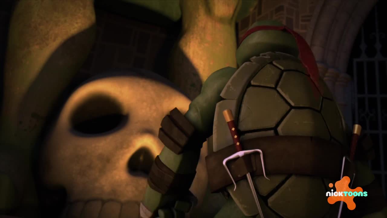 Raphael, from the Nicktoons show, stands with his back to me, looking at a giant skull. His sai and katana are strapped to his shell, ready for action.
