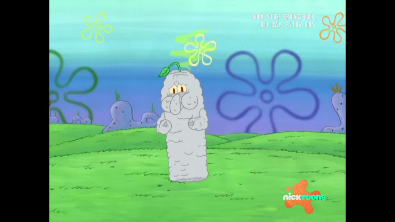 A gray, cylindrical figure with a sprout on top stands on a grassy field. He's got a sad expression, and the Nicktoons logo is in the corner.
