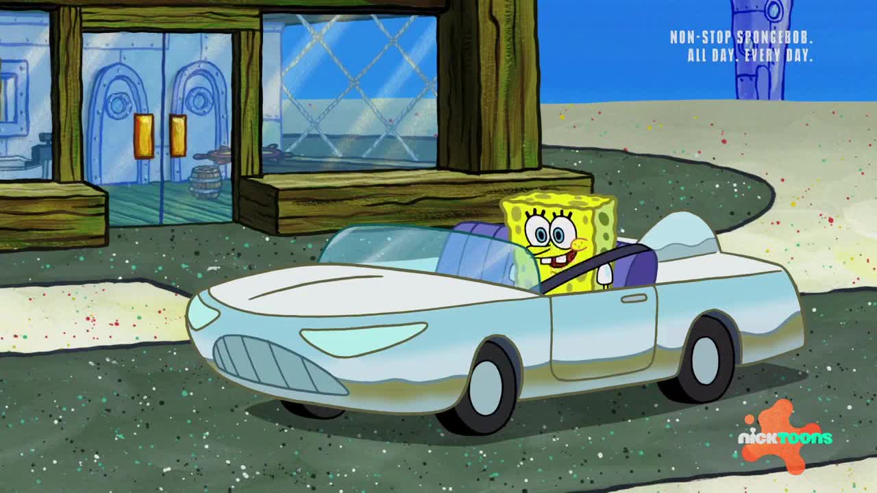 SpongeBob grins from behind the wheel of a light blue car, driving past a building. The car is moving along a speckled road, the scene clearly from a Nicktoons cartoon.
