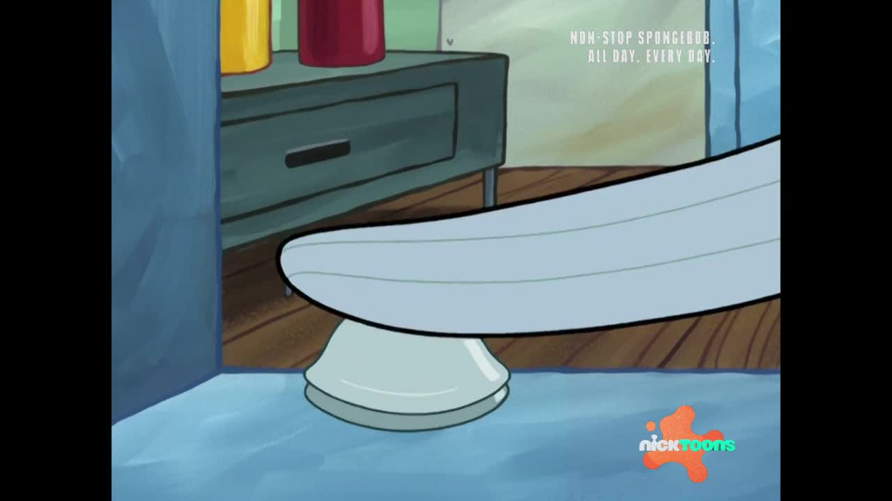 A light blue surfboard is being stepped on, pressing down on a white clam. The wooden floorboards are visible beneath the clam.