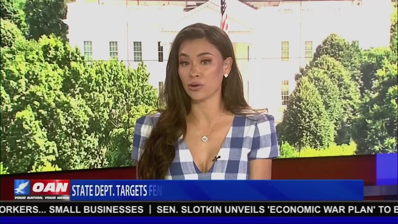 A woman in a blue and white checkered dress is speaking into a camera, with the White House visible in the background. The lower third of the screen displays the logo for One America News Network and a headline about the State Department.
