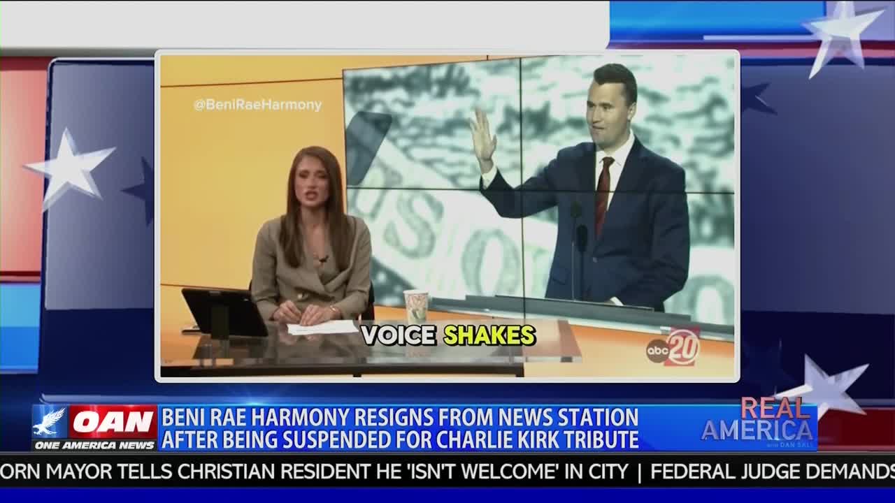 A news anchor sits at a desk, while a clip of a man in a suit plays on a screen behind her. The chyron at the bottom of the screen reads "Beni Rae Harmony Resigns from News Station."
