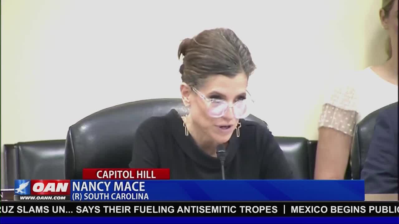 Nancy Mace, a Republican from South Carolina, is speaking into a microphone on Capitol Hill, as seen on One America News Network. The lower third of the screen displays the OAN logo and a headline about antisemitism.
