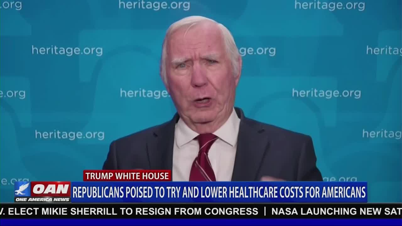 A man in a suit and tie speaks directly to the camera, his mouth open as if mid-sentence. The lower third of the screen, branded with "OAN" from One America News, displays a headline about Republicans and healthcare.
