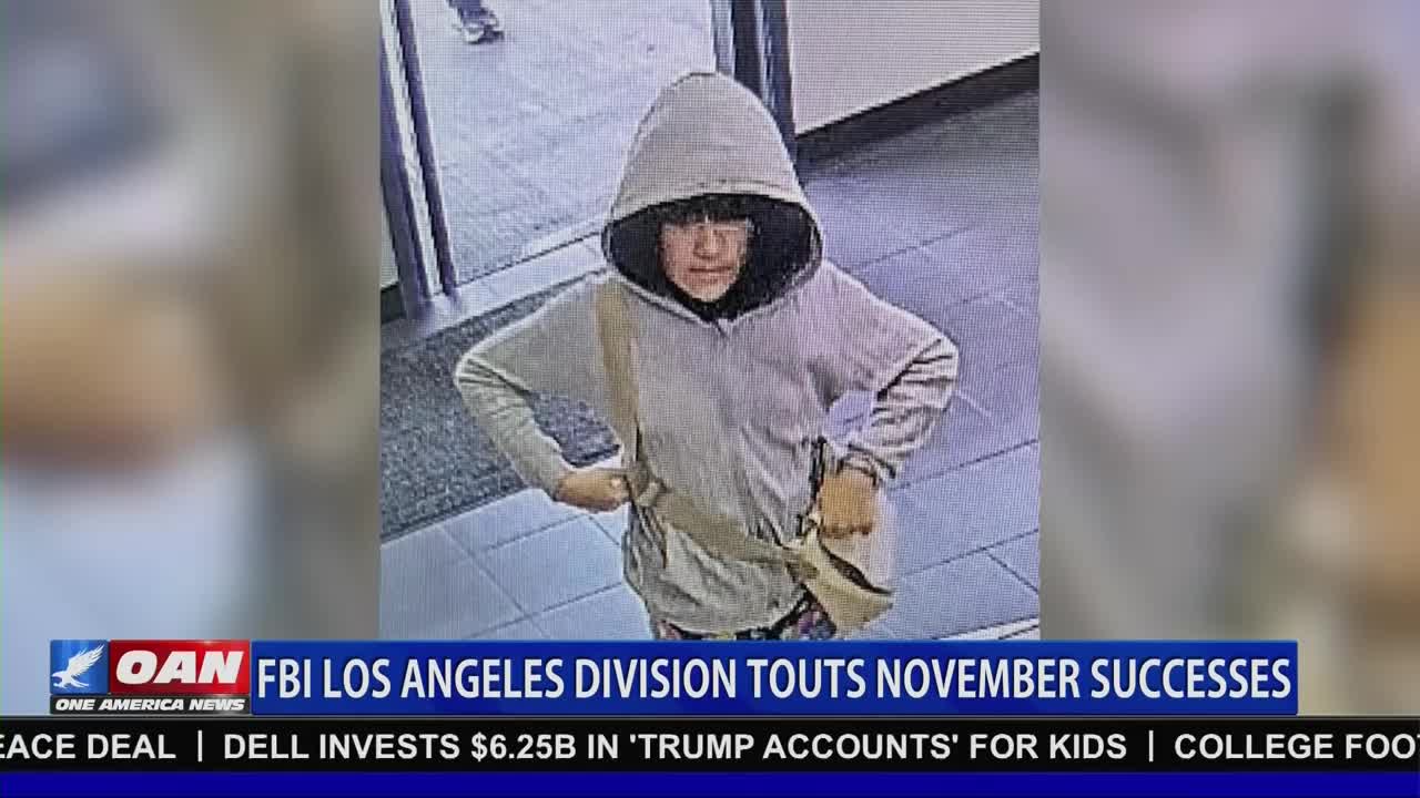A person in a gray hoodie and a crossbody bag stares directly at the camera. The image is part of a news segment from One America News Network, with a headline about the FBI's Los Angeles division.
