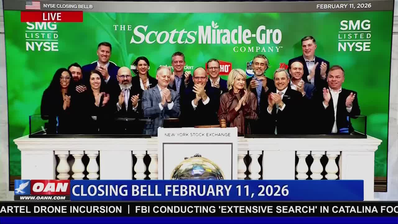 A group of people stand on a platform, clapping. The Scotts Miracle-Gro Company logo is displayed behind them.