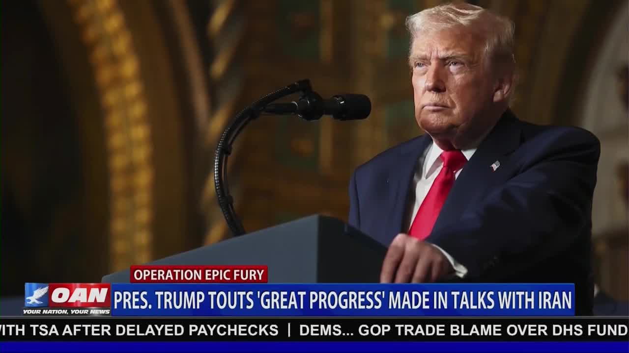 President Trump stands behind a podium, speaking into a microphone. A graphic on the screen reads "PRES. TRUMP TOUTS 'GREAT PROGRESS' MADE IN TALKS WITH IRAN."