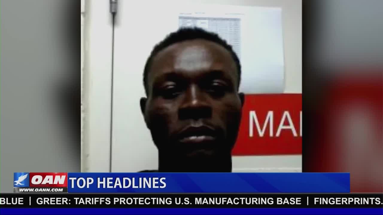 A man's face fills the screen, his expression unreadable. Below, the One America News Network banner displays "TOP HEADLINES" and a report about tariffs.