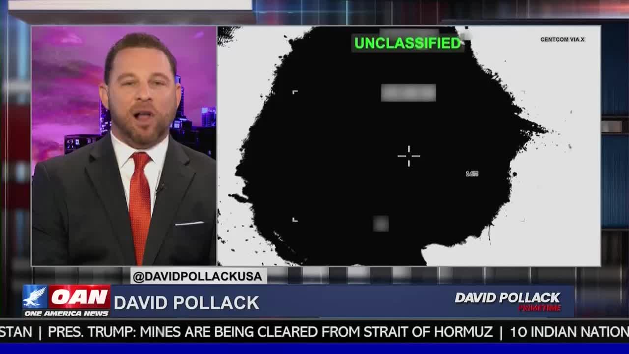 A man in a suit and tie speaks on a screen, next to a black and white map marked "UNCLASSIFIED." A chyron below identifies him as David Pollack of One America News.