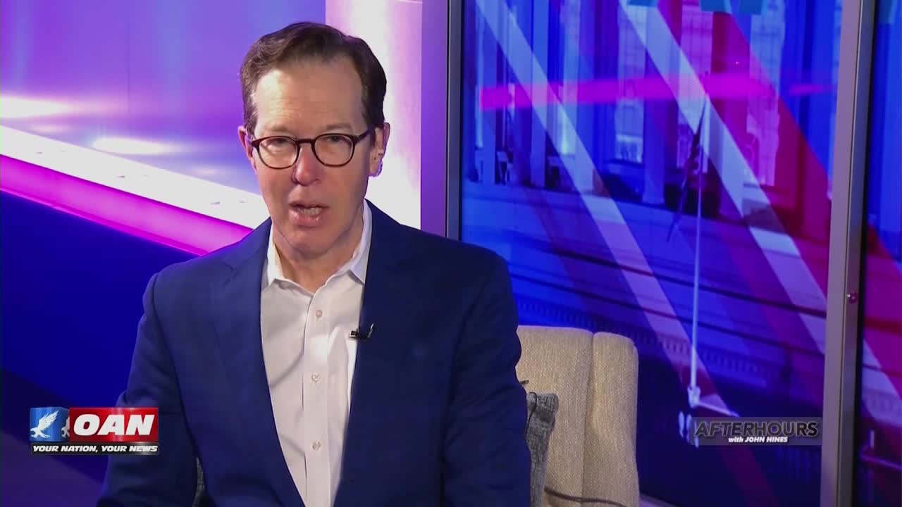 A man in a blue suit and glasses speaks directly to the camera. The One America News Network logo appears in the lower left corner.