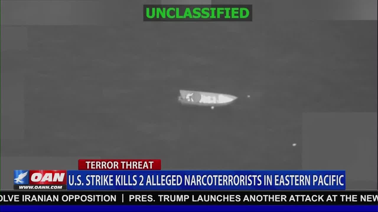 A small boat moves across dark water, its occupants visible. A U.S. strike has just occurred, as reported by One America News Network.