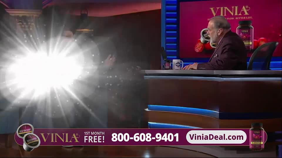 A bright light bursts from the left, obscuring a person standing behind it. On the right, a man in a suit sits at a desk, seemingly unfazed.

