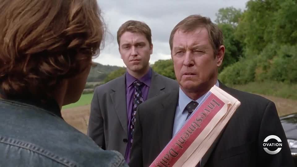 A man in a dark suit holds a newspaper, its headline reading "Investment Daily," as he stares intently. Two other men in suits stand behind him, one with a concerned expression.
