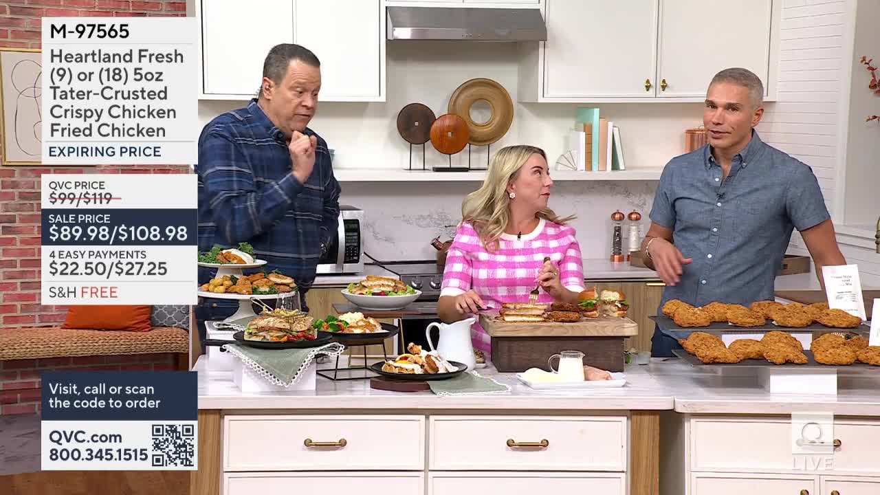 Three people stand behind a counter, gesturing toward plates of fried chicken and sandwiches. The woman in the pink dress is holding a fork, while the man on the right gestures at a tray of chicken.

