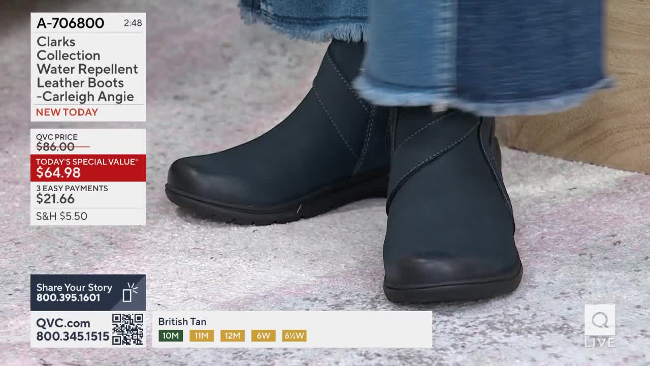 A pair of dark blue ankle boots is on display, the camera focused on the shoes' details. The QVC price is shown on screen, along with the special value for the day.
