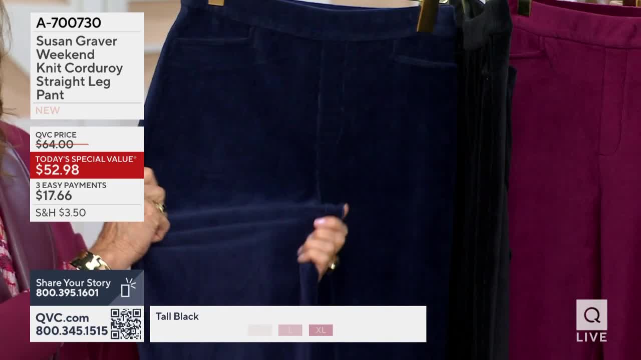 Someone is holding up a pair of navy corduroy pants on a hanger, stretching the fabric to show its texture. A screen displays the QVC price and special value of the pants.
