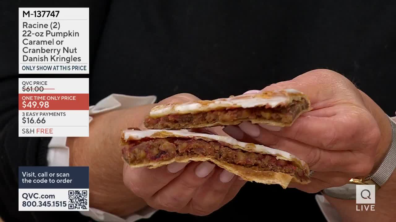 A woman holds two halves of a Danish Kringle, showcasing the filling and frosting. The QVC price is displayed on the screen, offering the pastry at a discounted rate.
