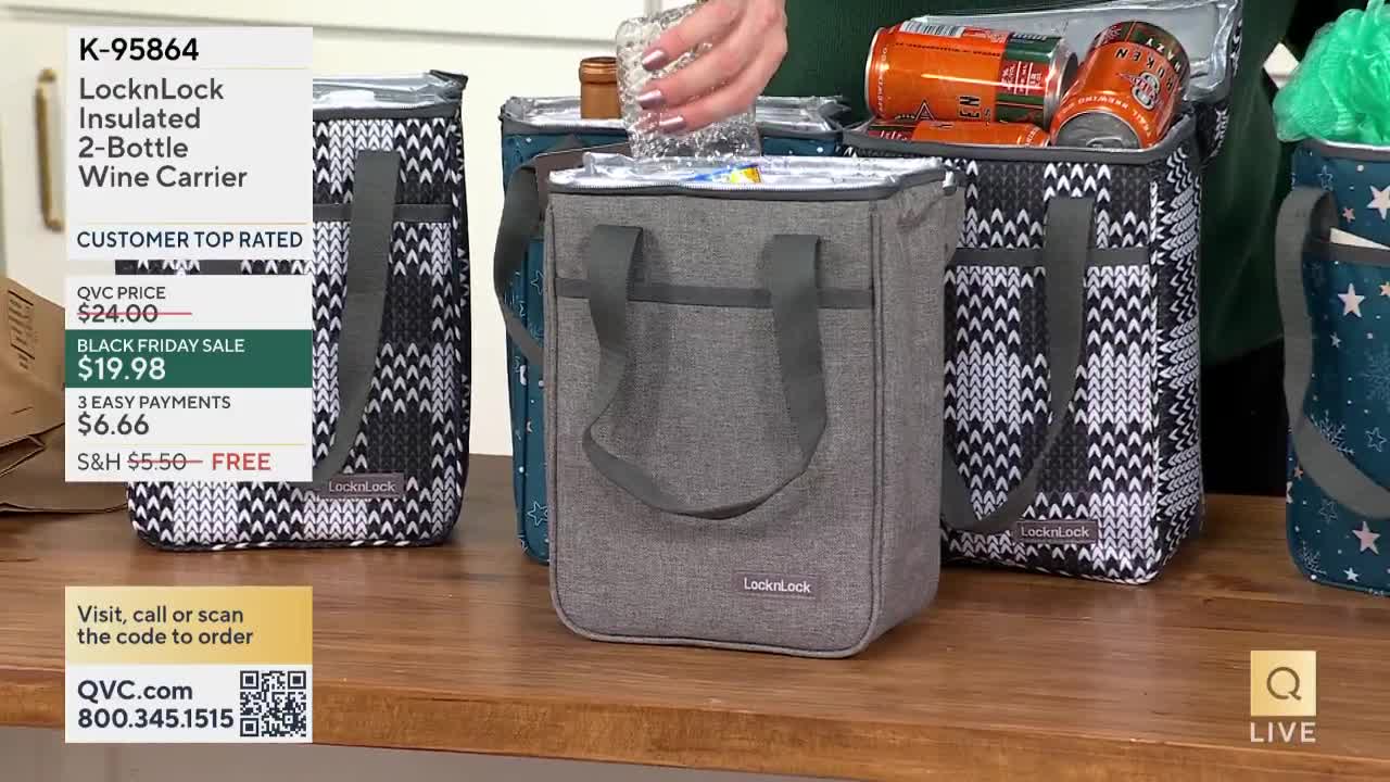 A hand is placing a small, clear container inside a gray LocknLock wine carrier. Other carriers, some patterned and some filled with drinks, sit on a wooden surface in what appears to be a QVC studio.
