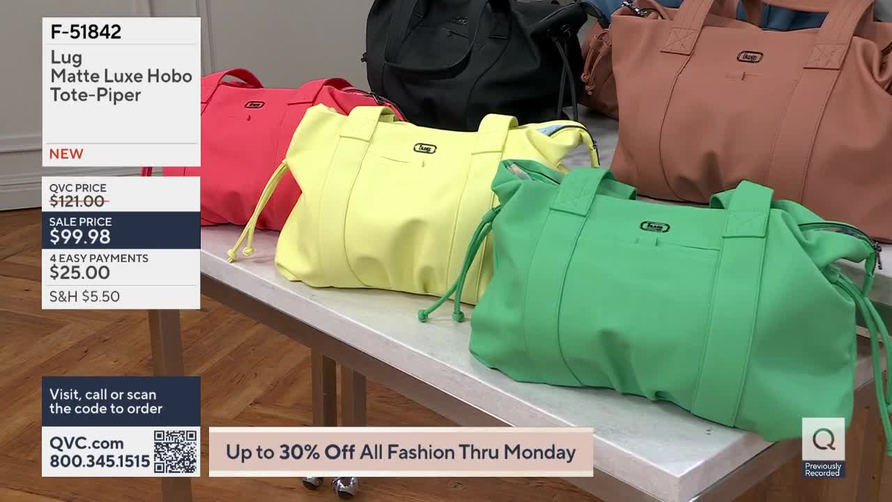 A line of colorful tote bags sits on a table. A bright green bag is in the foreground, with a yellow one behind it.