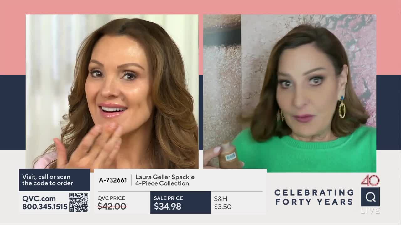 A woman with brown hair, wearing a pink top, gestures to her face as she smiles. Beside her, another woman in a green sweater holds up a small bottle.