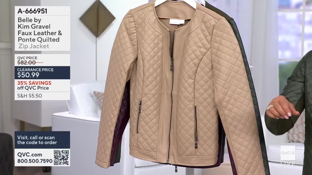 A tan quilted zip jacket hangs on a rack, its details highlighted on QVC2. Beside it, a woman in a similar green jacket gestures toward the camera.
