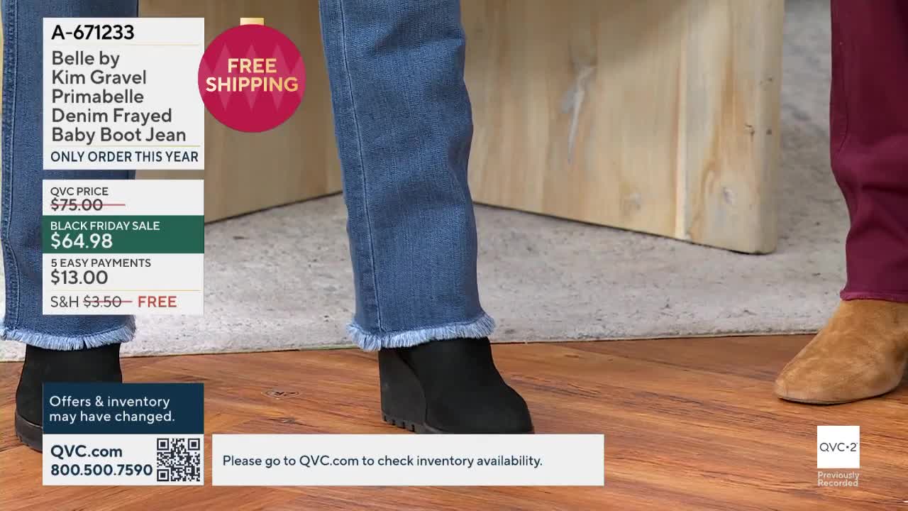 A woman's legs are the focus, wearing frayed-hem jeans and black wedge booties. The QVC2 logo is visible, and a graphic details the jeans' price and sale information.
