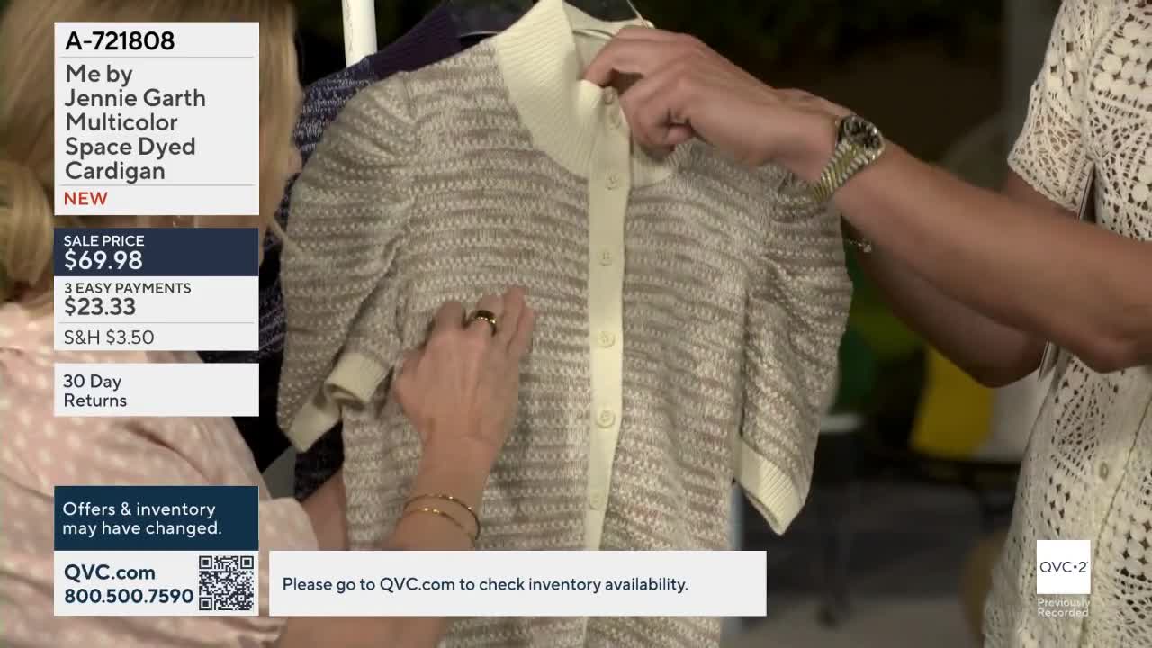 A hand smooths the front of a beige and white striped cardigan. Another hand adjusts the collar of the same garment.