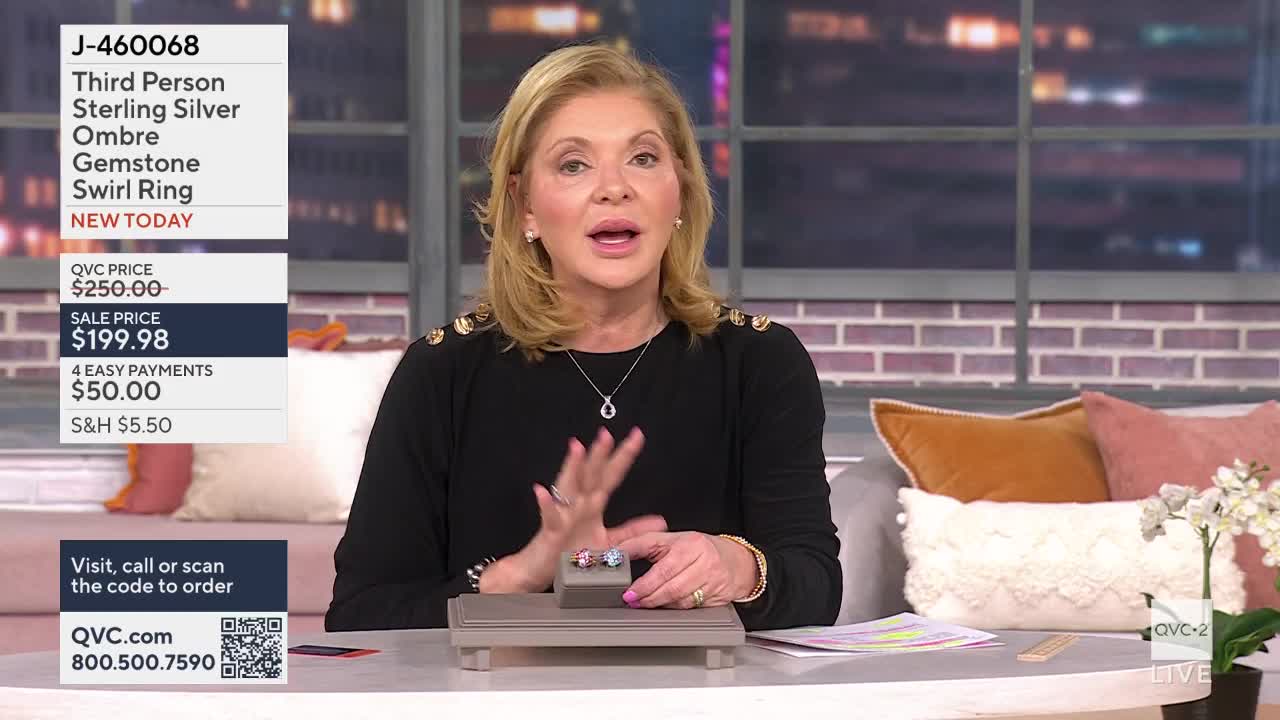A woman on QVC2 is presenting a sterling silver ring with ombre gemstones. She gestures with her hands as she talks about the sale price of $199.98.