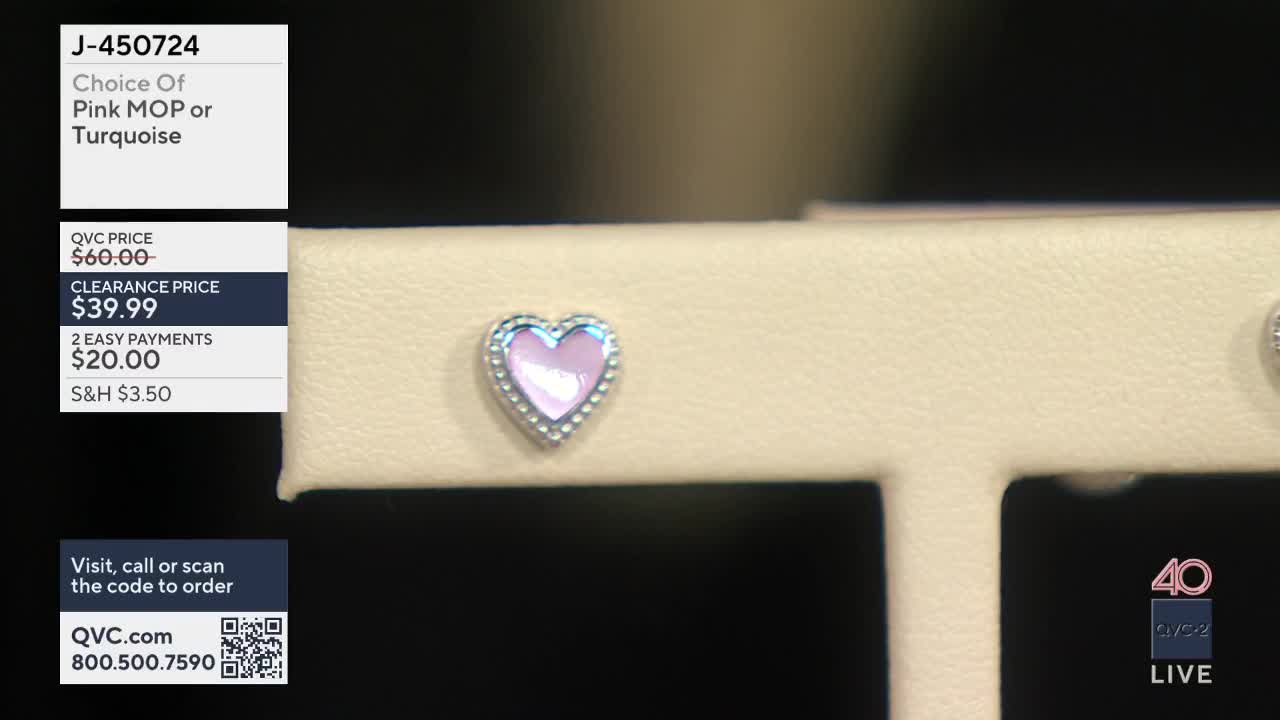 A delicate pink heart-shaped earring, framed by tiny silver beads, rests on a cream-colored display. The QVC2 logo and "LIVE" are visible in the corner.