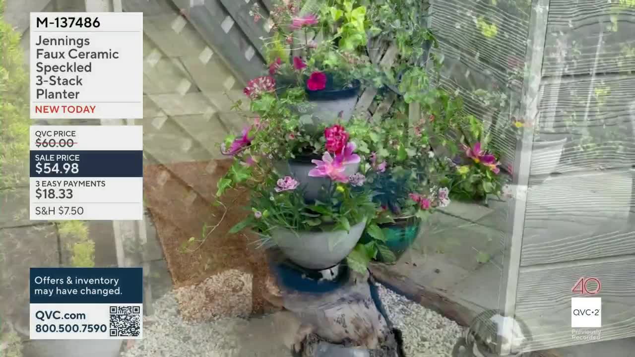 A tiered planter overflows with pink and green foliage, set against a wooden lattice backdrop. This QVC2 presentation highlights a sale price for the Jennings Faux Ceramic Speckled 3-Stack Planter.