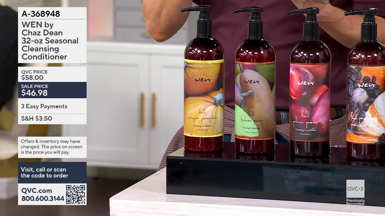 On a black display stand, four bottles of WEN cleansing conditioner are lined up, each with a different fall-themed label. The QVC3 logo is visible in the corner, and the price is listed on the screen.
