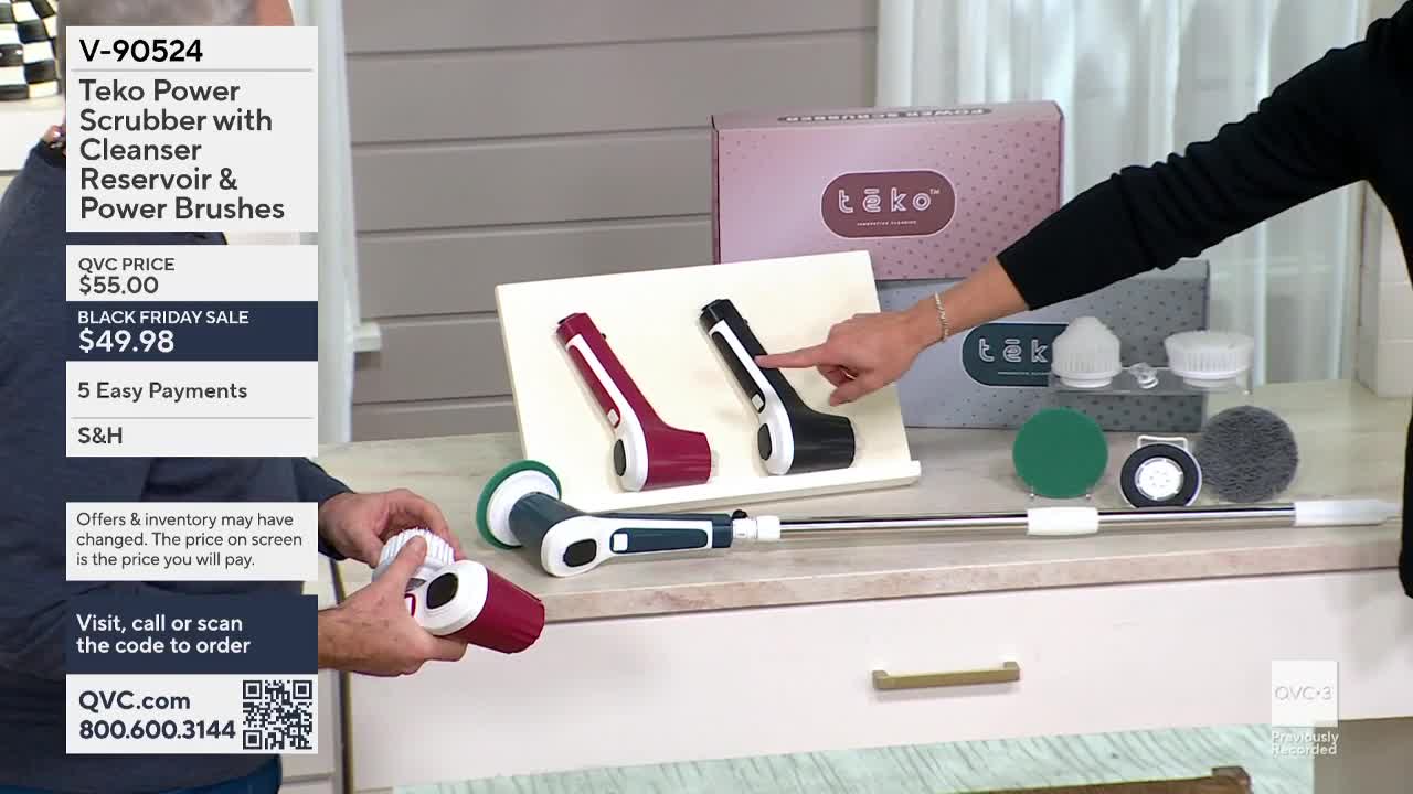 On QVC3, a host points to a black and a burgundy scrubber, while another person assembles one with a white brush head. The product is displayed with other attachments and a box labeled "tāko."
