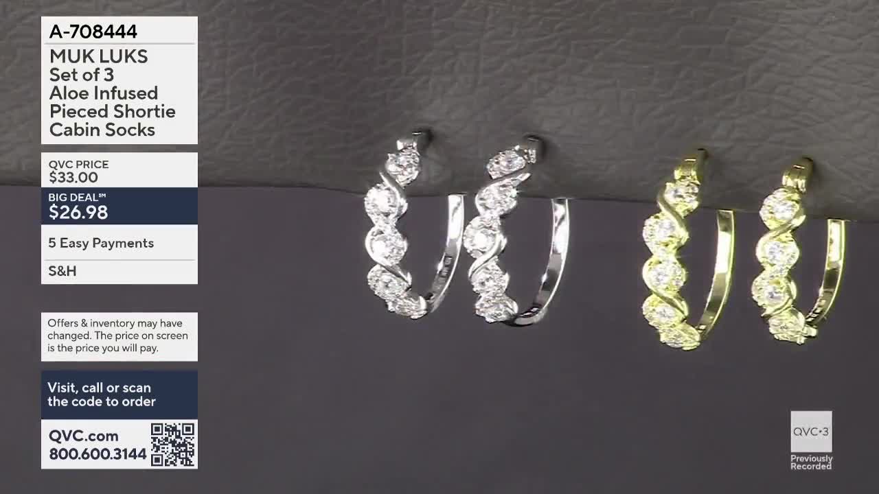On QVC3, two pairs of silver hoop earrings and a pair of gold ones are displayed against a dark background. The product description mentions "Aloe Infused Pieced Shortie Cabin Socks," but the focus is clearly on the jewelry.
