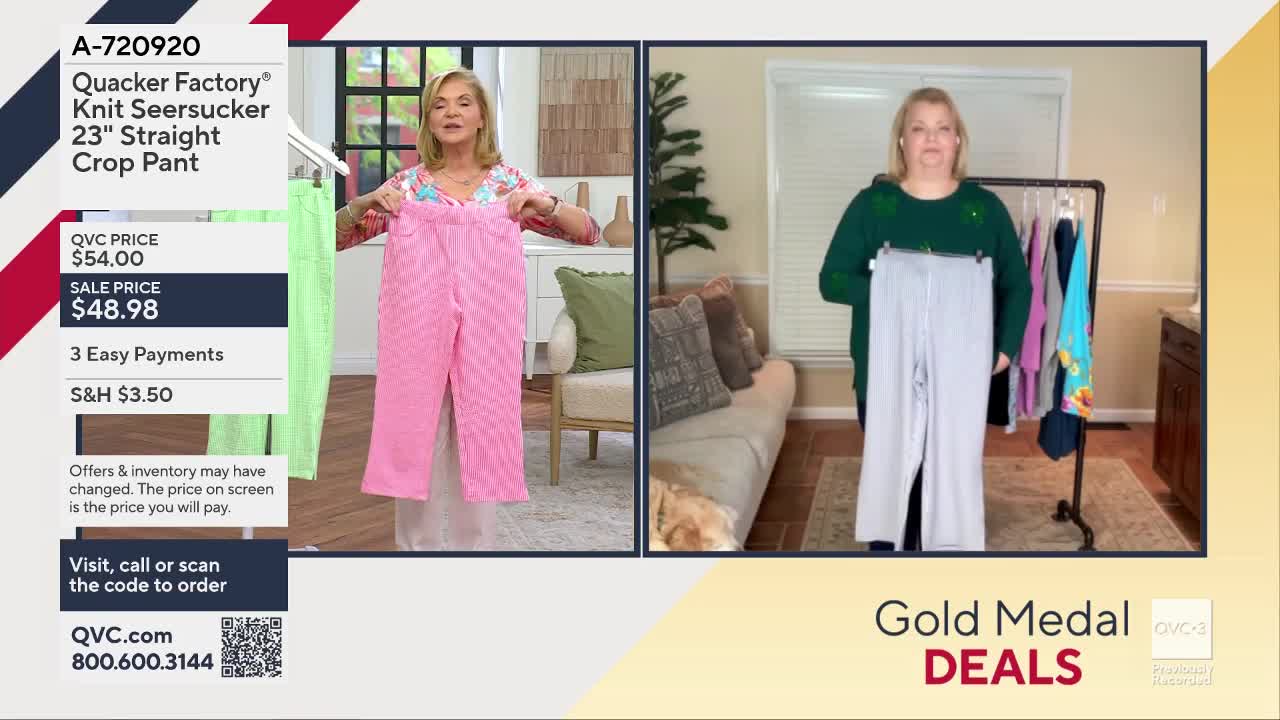 A woman on QVC holds up a pair of pink seersucker pants. To her right, another woman displays a pair of light gray pants.