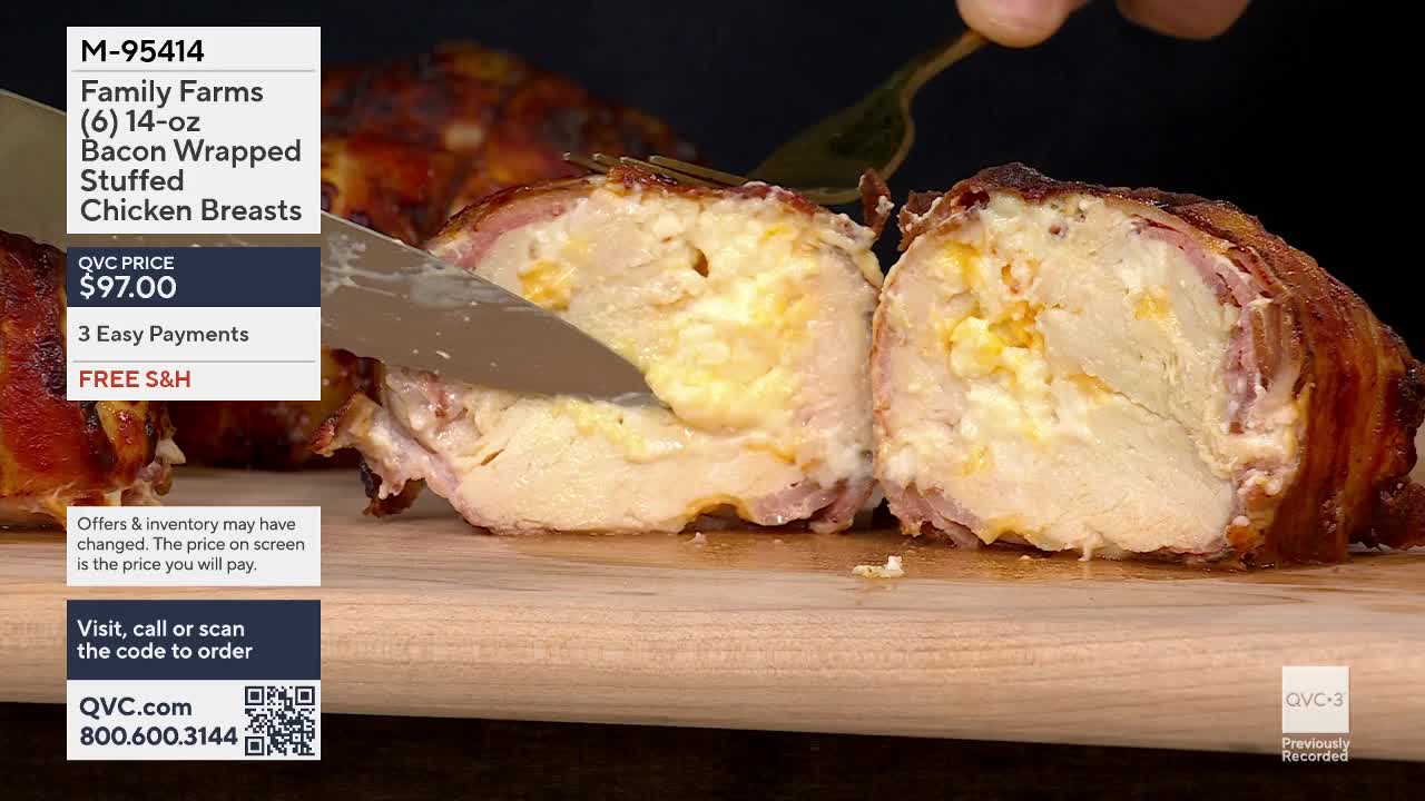 A knife slices into a bacon-wrapped chicken breast, revealing a creamy, cheesy filling. Another fork steadies the dish as the cut is made.