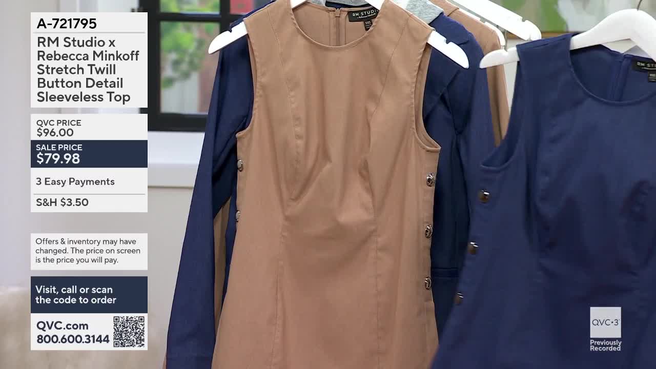 A tan sleeveless top hangs on a hanger, its buttons glinting. Beside it, a navy blue top is also displayed.