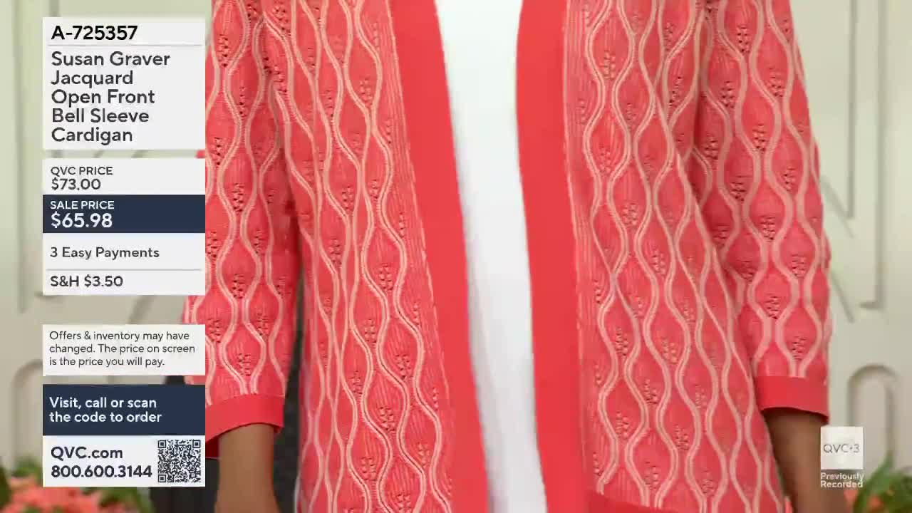 A woman stands wearing a coral-colored cardigan with an open front and a textured pattern. The QVC3 logo appears in the lower right corner.