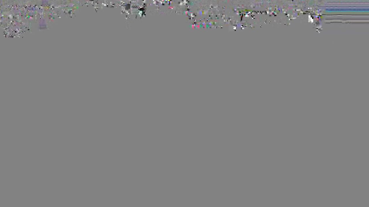 The image is heavily pixelated, but it appears to show a crowd of people. They seem to be gathered outdoors, possibly in a public space.
