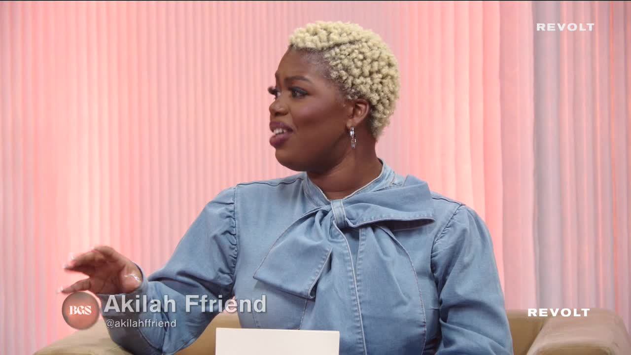 A woman with short, curly blonde hair gestures with her left hand while speaking. The "REVOLT" logo is visible, and a lower third identifies her as Akilah Ffriend.
