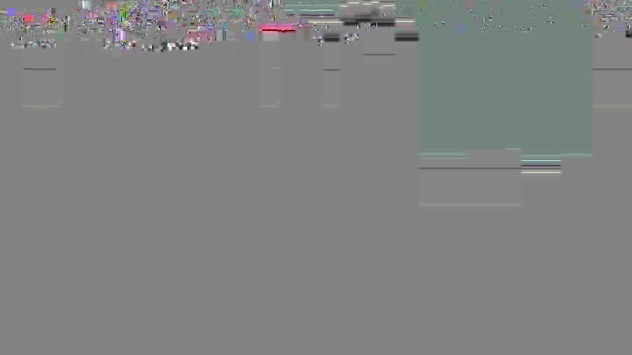 It appears there is a screen with a lot of visual noise, possibly a digital glitch. The top of the screen has a lot of color.