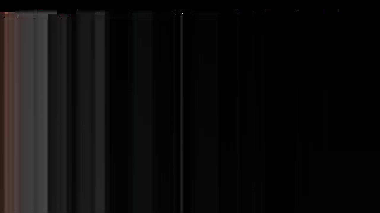 Vertical bands of varying shades of gray and black are present, with a hint of reddish-brown at the left edge. The image appears to be a glitch or distortion, with the lines creating a sense of movement.

