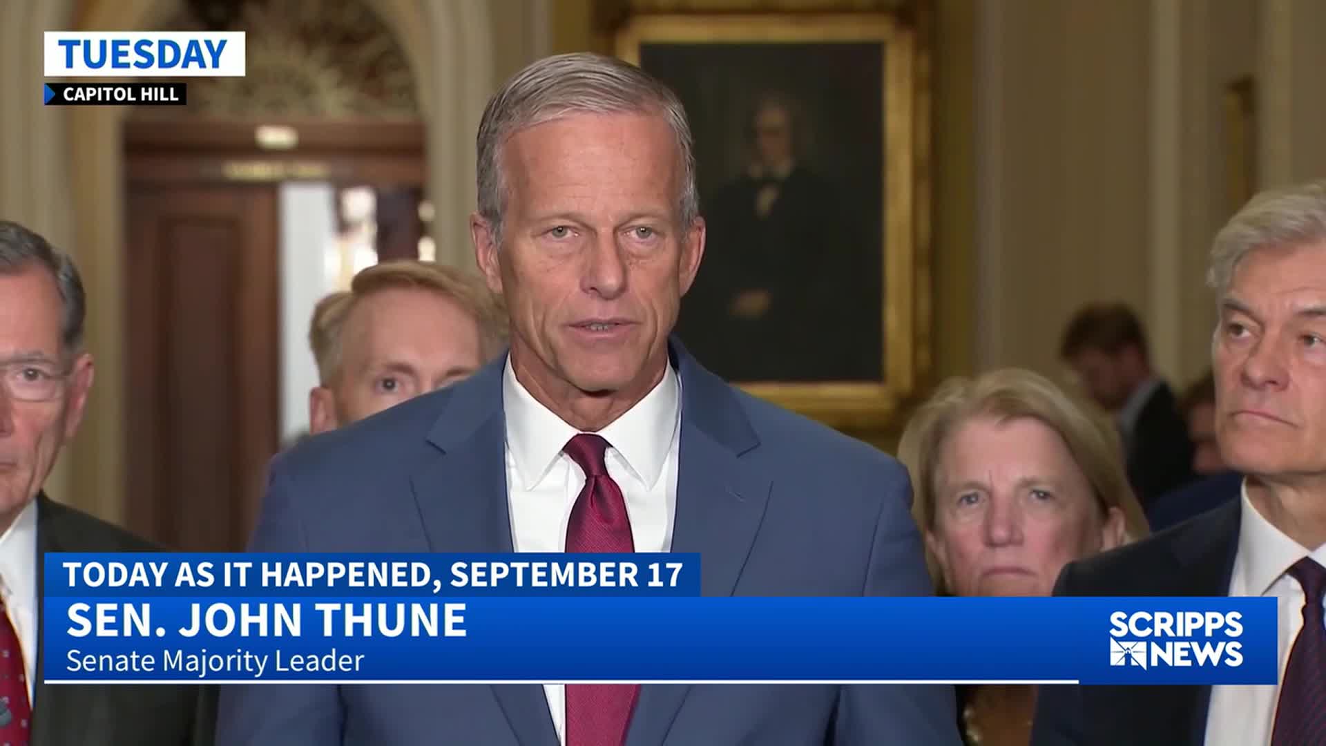 Sen. John Thune, the Senate Majority Leader, is speaking to the camera, flanked by other politicians. The Scripps News logo is visible as the broadcast comes from Capitol Hill.
