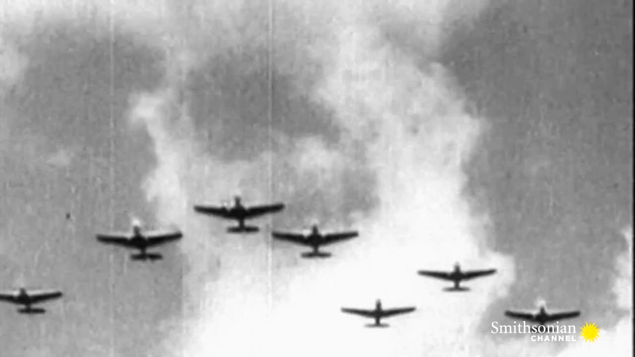 A formation of planes, silhouetted against a cloudy sky, is flying in a loose V-shape. The Smithsonian Channel logo is visible in the bottom right corner.

