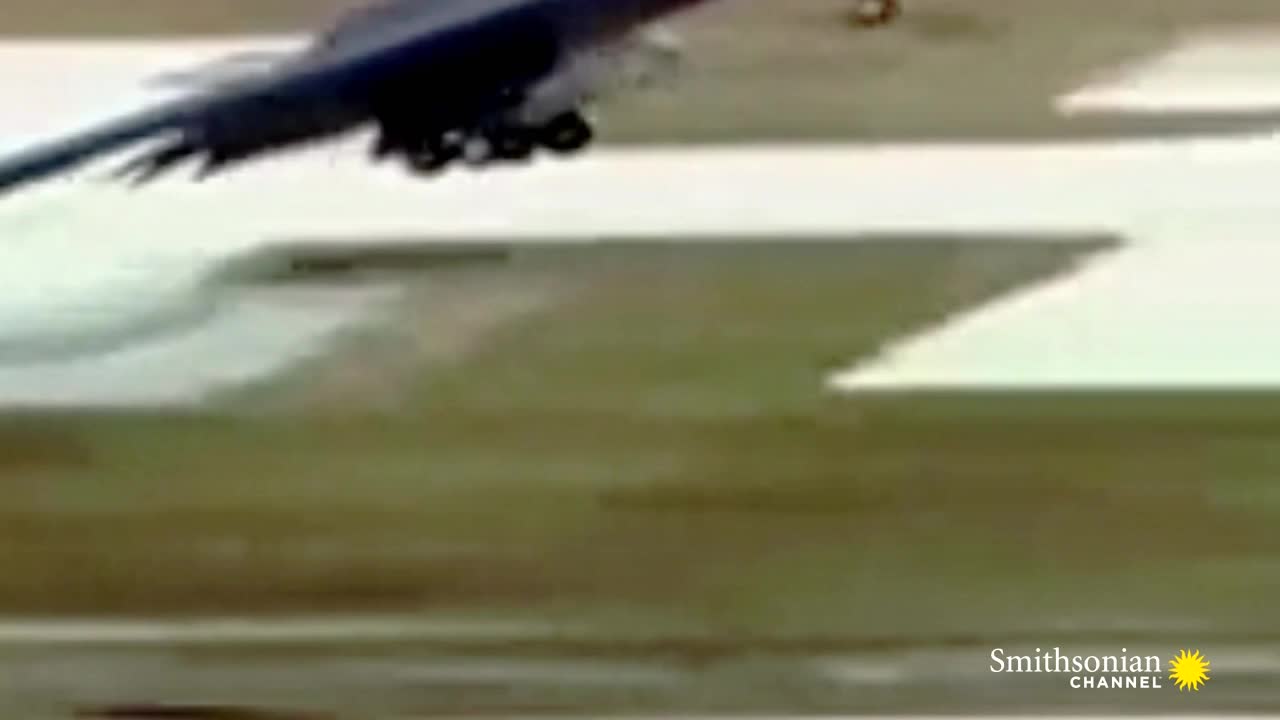 A dark aircraft, likely from the United States, is lifting off the ground. The Smithsonian Channel logo is visible in the corner.
