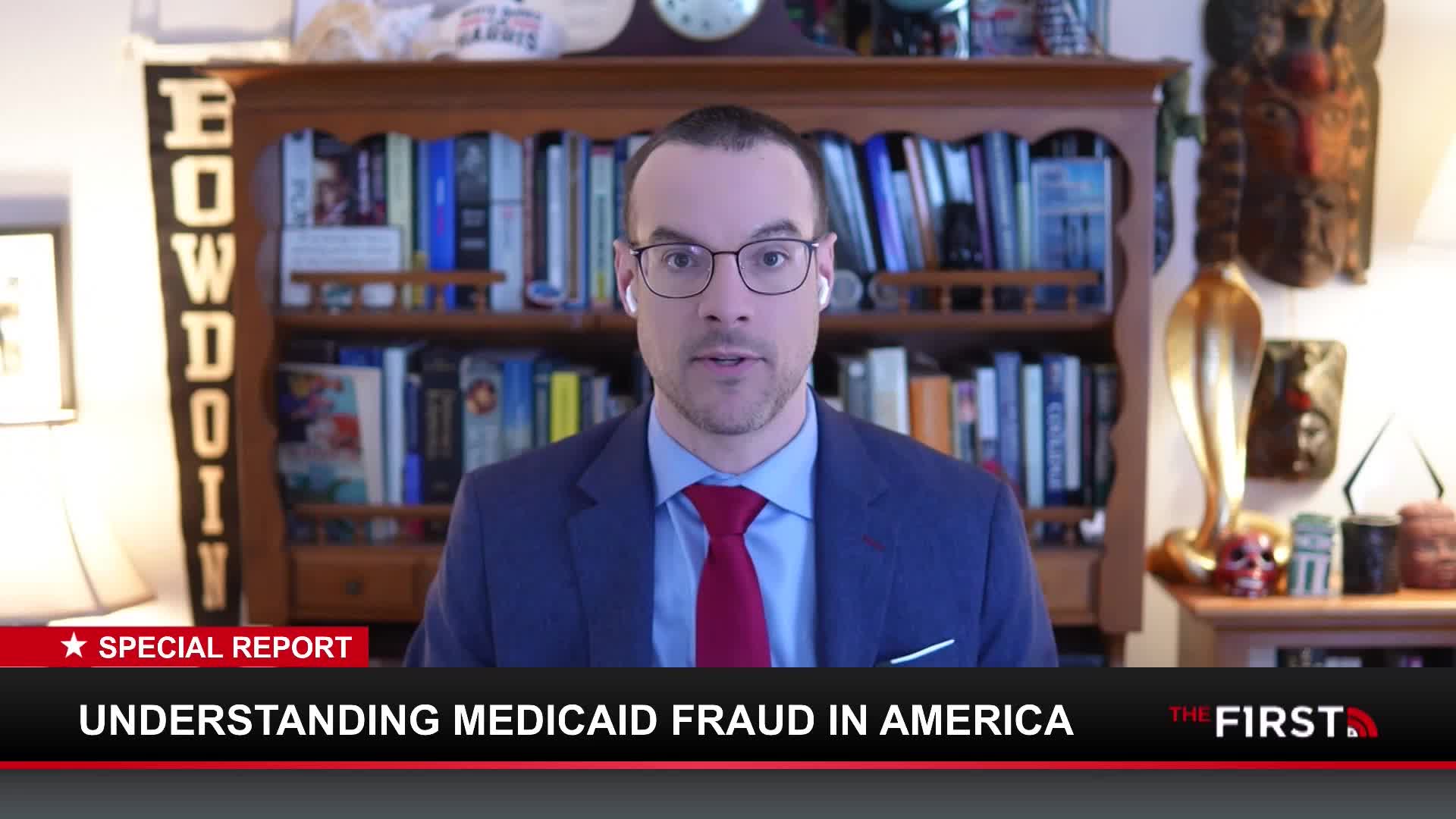 A man in a suit and tie speaks directly to the camera. A graphic banner below him reads "UNDERSTANDING MEDICAID FRAUD IN AMERICA" and "THE FIRST."