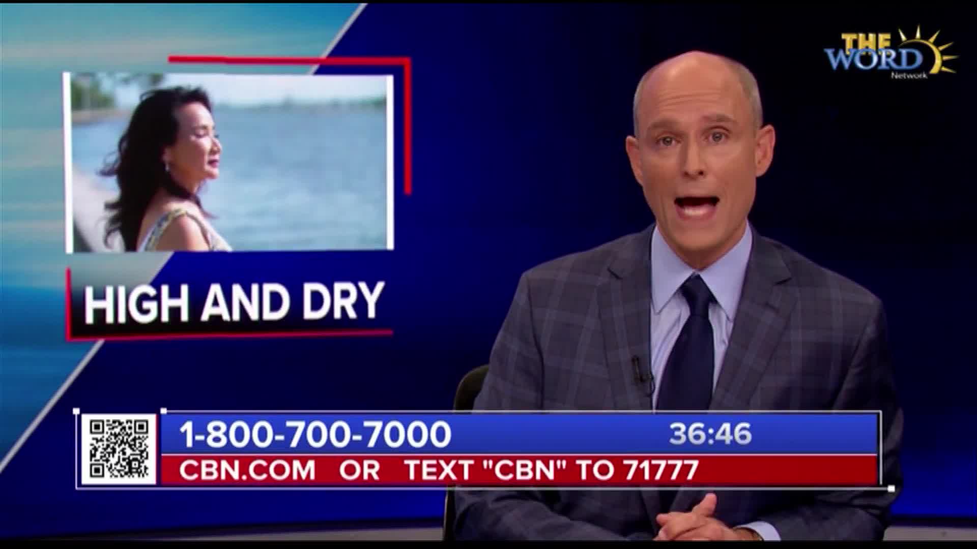 A man in a suit is speaking directly to the camera on The Word Network. A small inset shows a woman by the water, with the words "HIGH AND DRY" displayed below.
