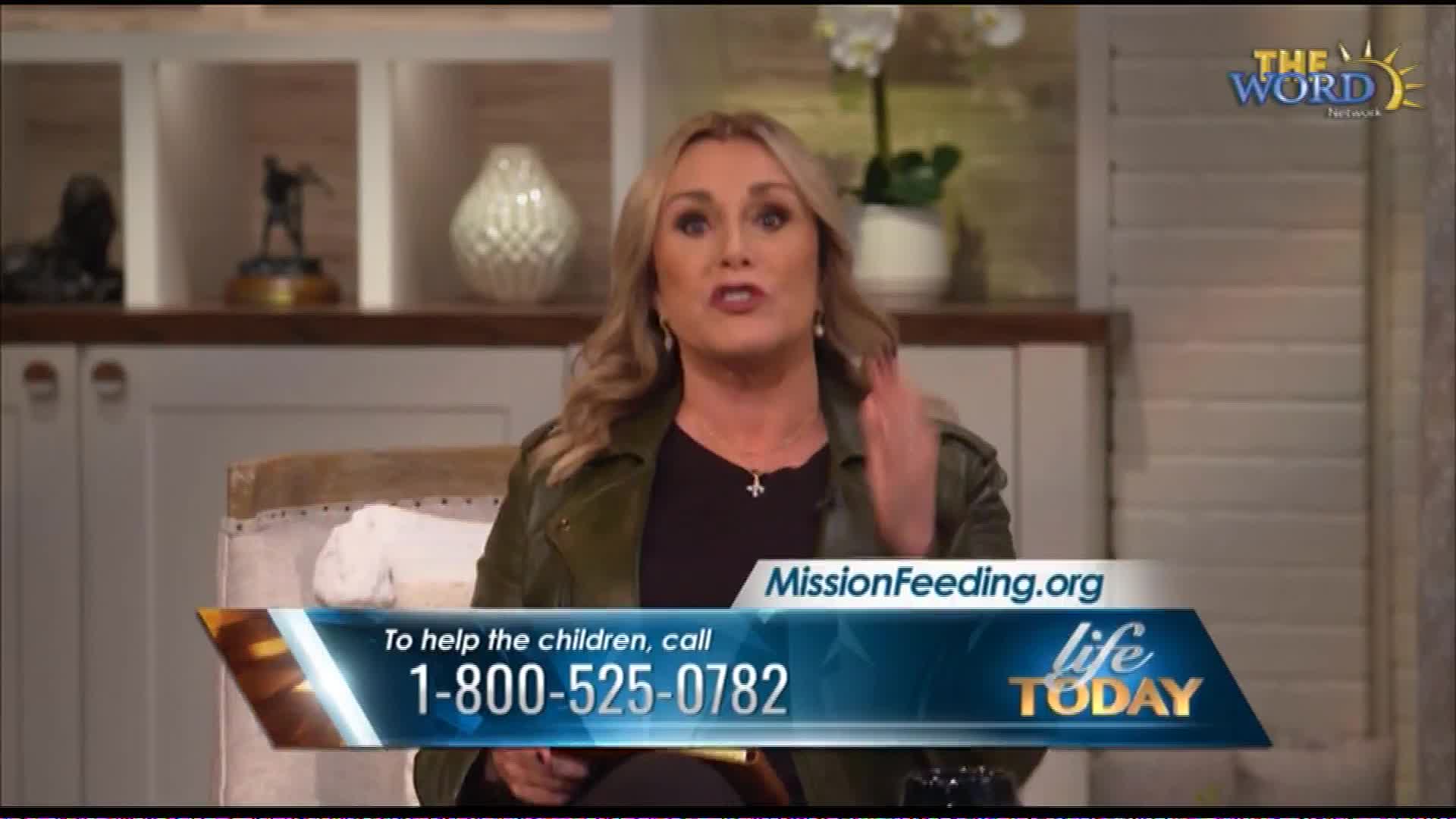 A woman on The Word Network gestures emphatically as she speaks. A graphic displays MissionFeeding.org and a phone number to help children.