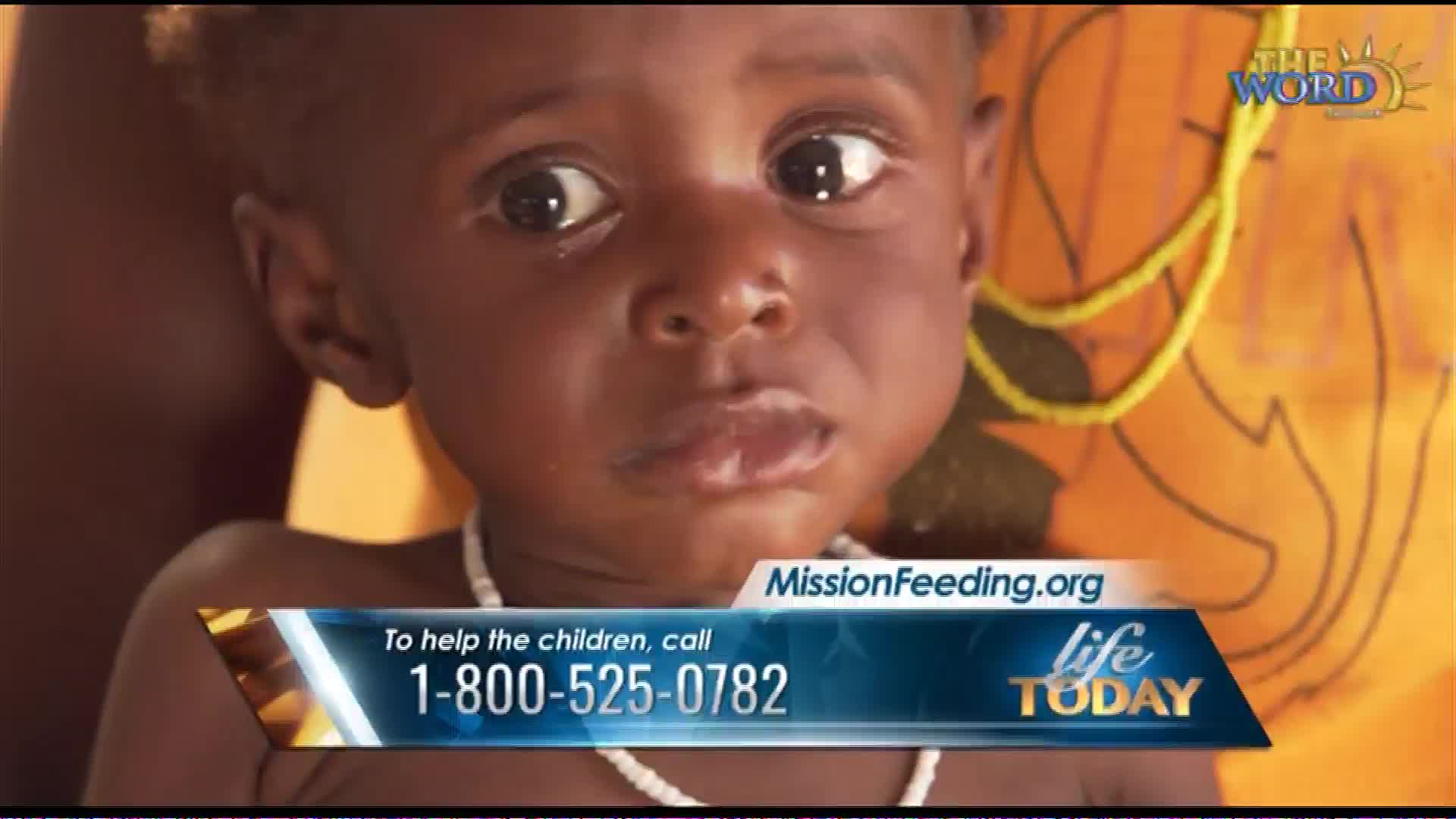 A young child with wide, dark eyes looks directly forward. Text overlays provide a website and a toll-free number for MissionFeeding.org, a program featured on The Word Network's "Life Today."